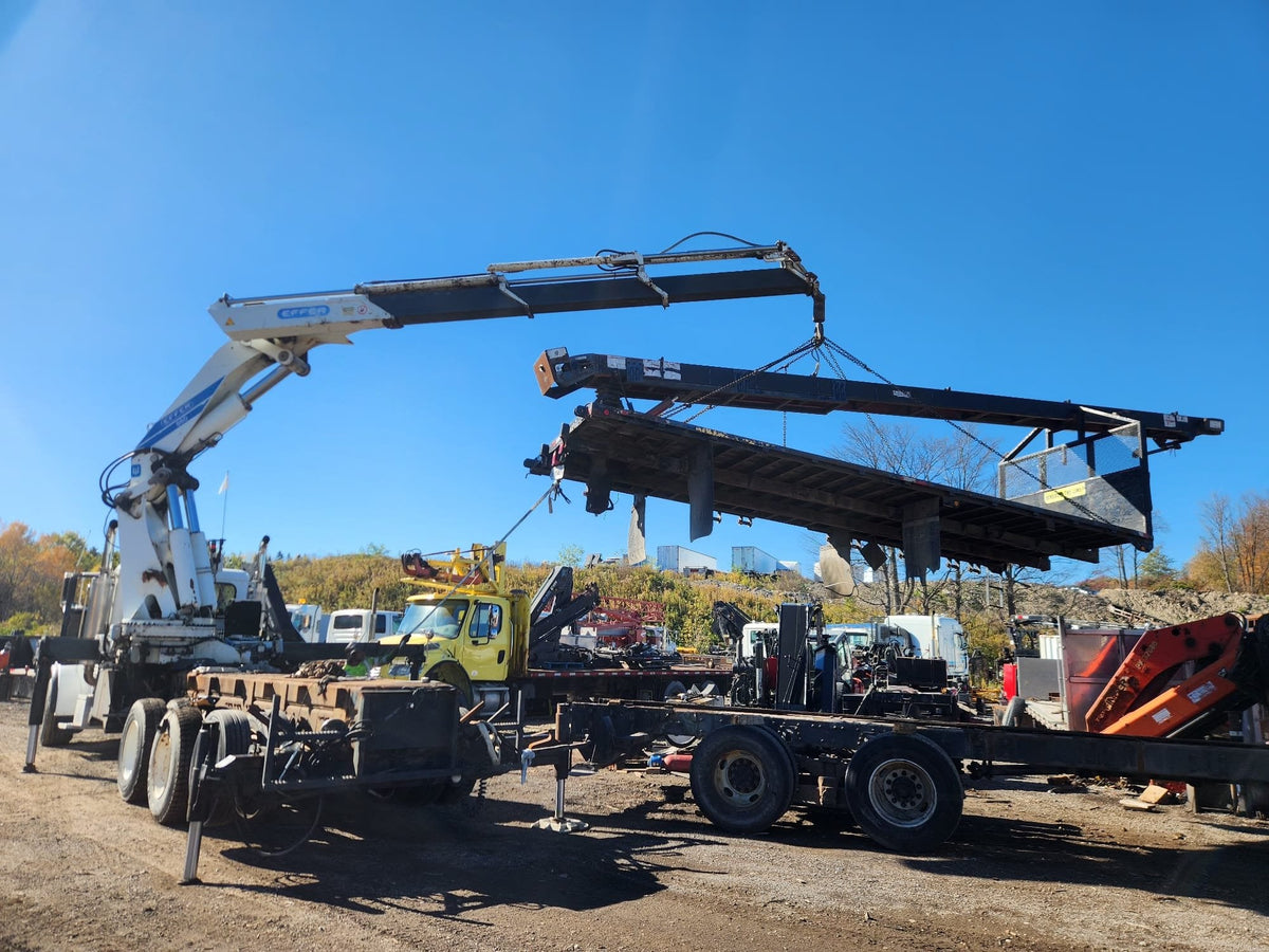 A busy day at the yard: taking equipment apart for container shipping